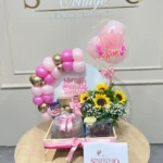 Desayuno sorpresa con globos, girasoles y torta