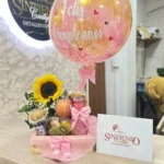 Desayuno sorpresa con girasol y globo