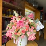 Cilindro con flores surtidas