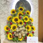 Arreglo floral en rosas y girasoles